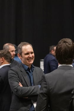 Attendee smiling while networking at the ChargeHub Awards ceremony.