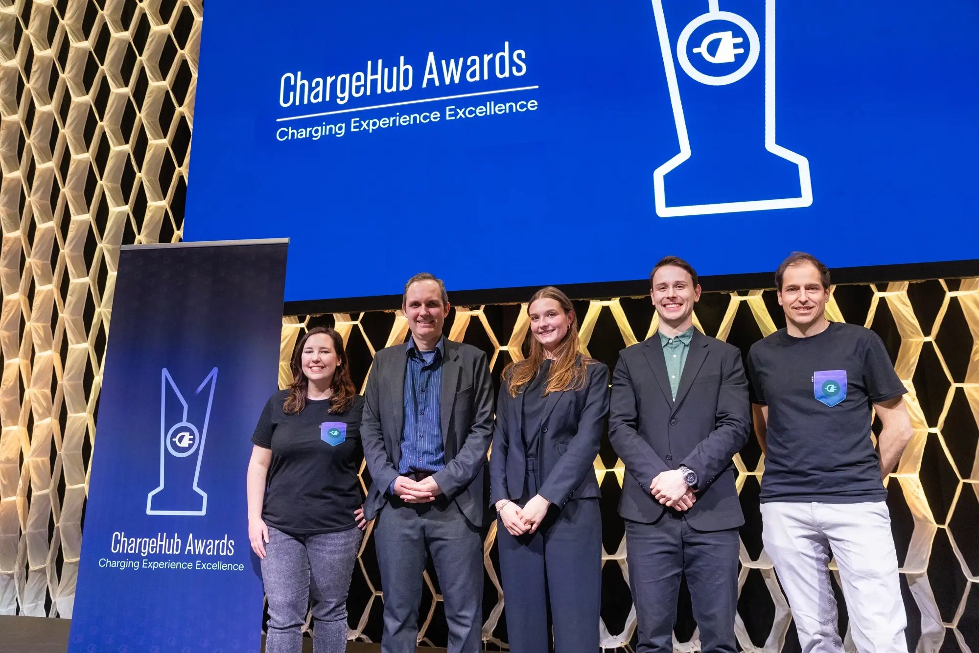 Simon Ouellette and ChargeHub team members pose on stage at the ChargeHub Awards ceremony.