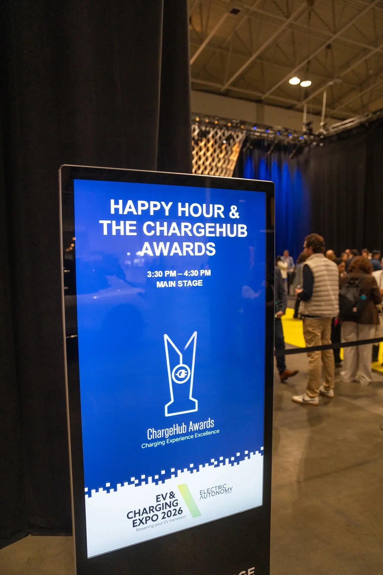 Digital sign for Happy Hour and the ChargeHub Awards at EV and Charging Expo 2026.