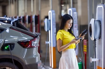 EV driver connecting to a fast charging station