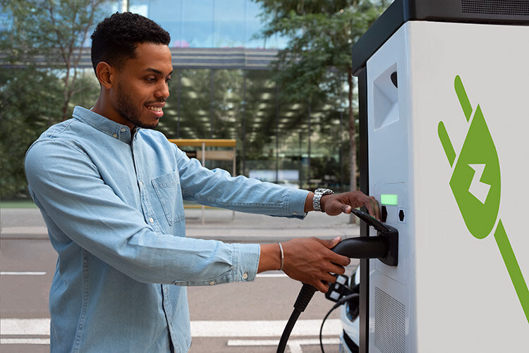 side-view-man-charging-electric-car