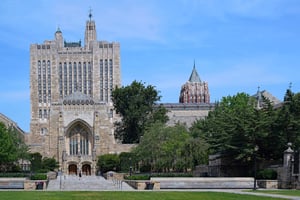 Sterling Memorial Library featuring collegiate Gothic architecture with stone carvings, stained glass windows, and a grand entrance.